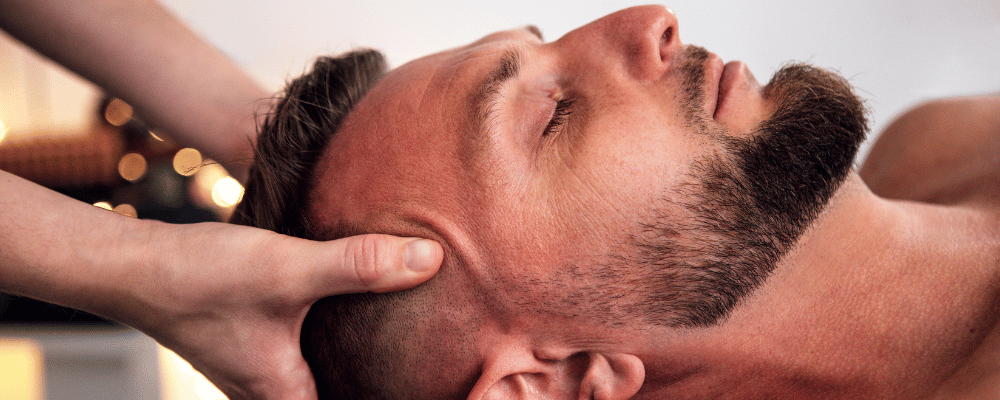 Client receiving a relaxing Headspace head and neck treatment at re:new Hair & Beauty in Woodhall Spa