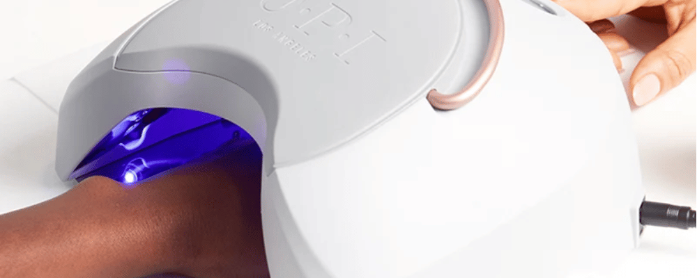 OPI gel manicure curing under an LED nail lamp at re:new Hair & Beauty in Woodhall Spa