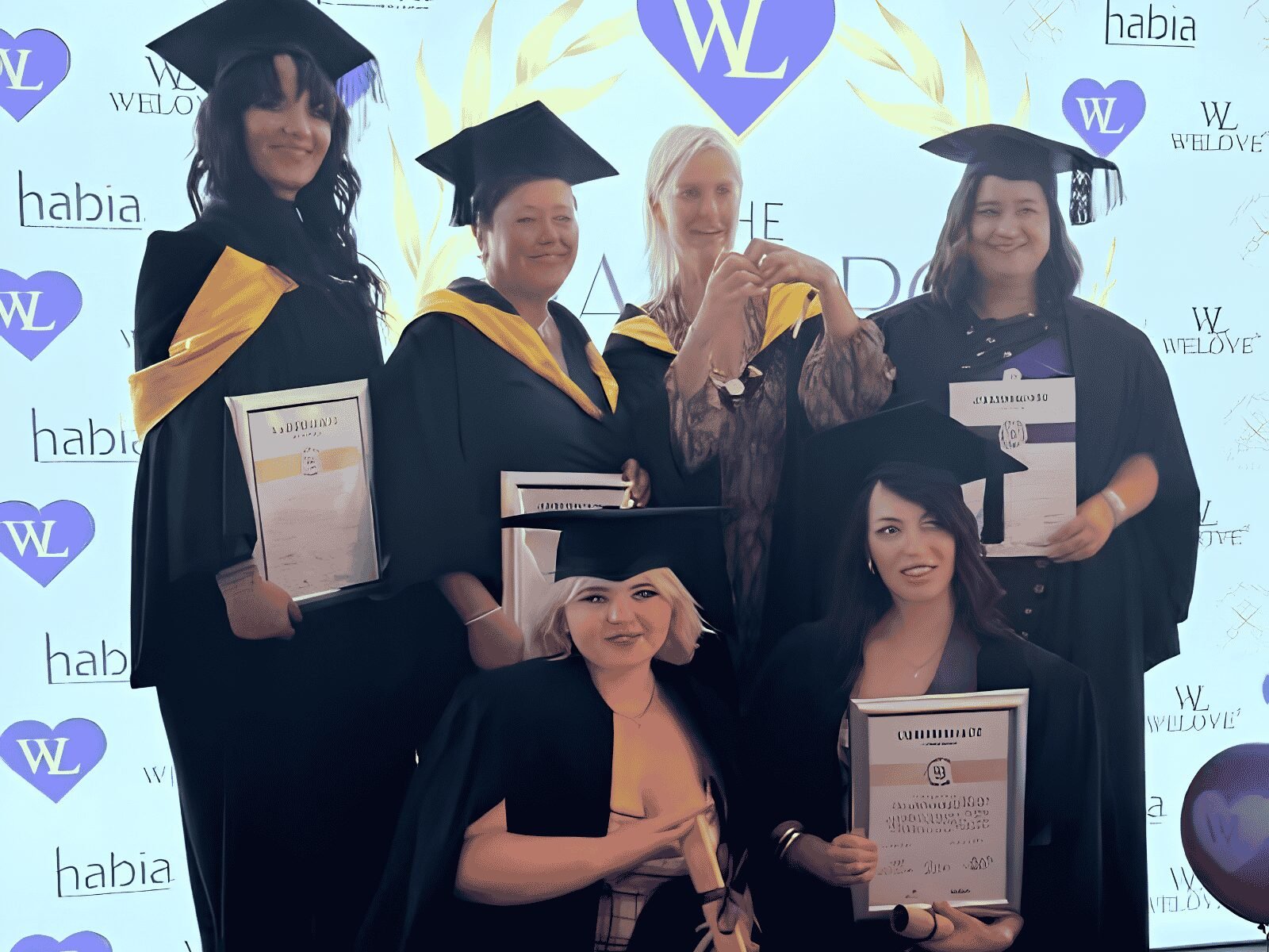 Members of the re:new Hair & Beauty team celebrating their HABIA graduation and professional achievements