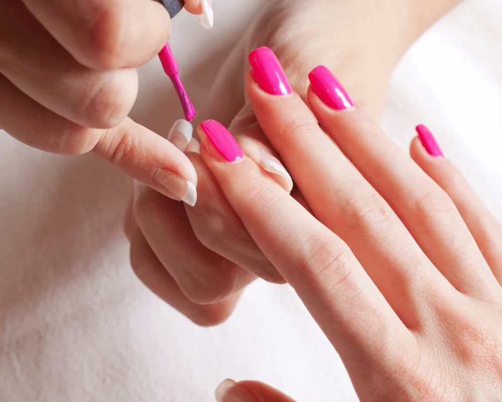 Bright pink OPI gel polish being applied during a manicure at re:new Hair & Beauty in Woodhall Spa