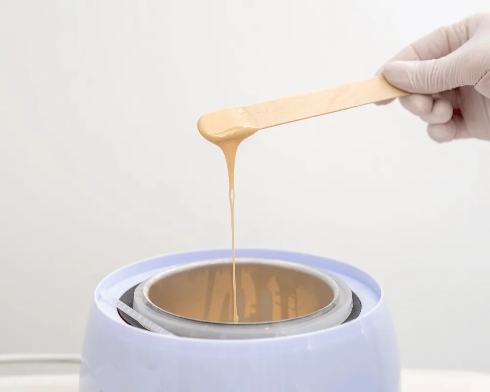 Professional Lycon wax being prepared for a hair-removal treatment at re:new Hair & Beauty in Woodhall Spa