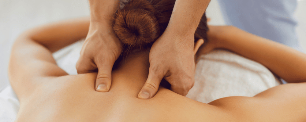 Client receiving a professional neck and shoulder massage at re:new Hair & Beauty in Woodhall Spa