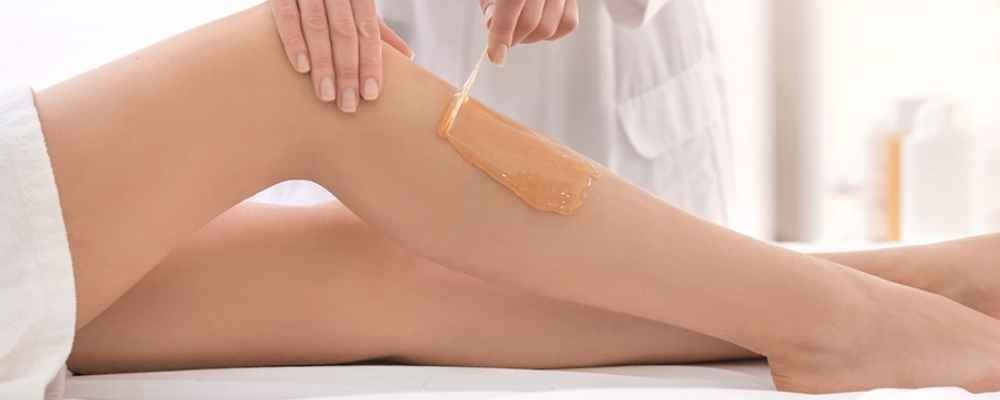 Lycon warm wax being applied during a professional leg-waxing treatment at re:new in Woodhall Spa