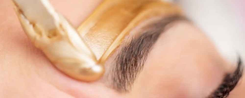 Lycon warm wax applied during an eyebrow waxing treatment at re:new Woodhall Spa