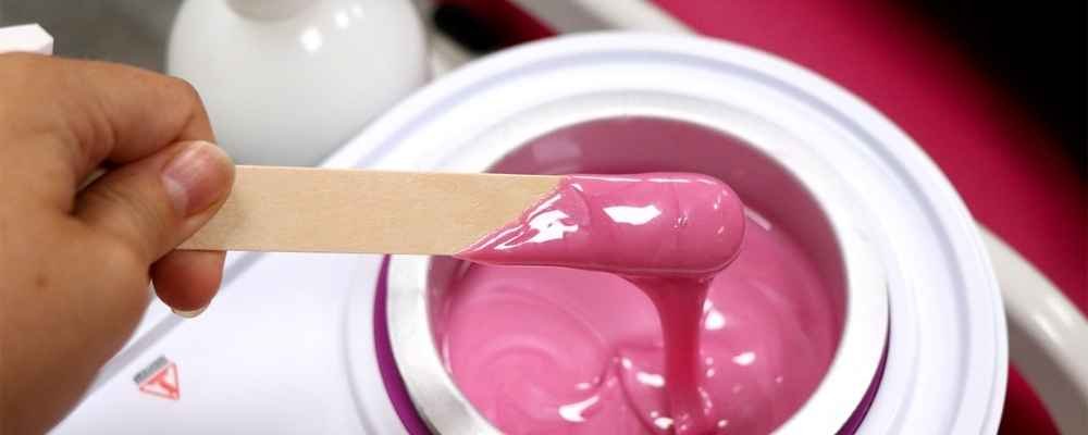 Pink Lycon hot wax being prepared for a professional waxing treatment at re:new Woodhall Spa