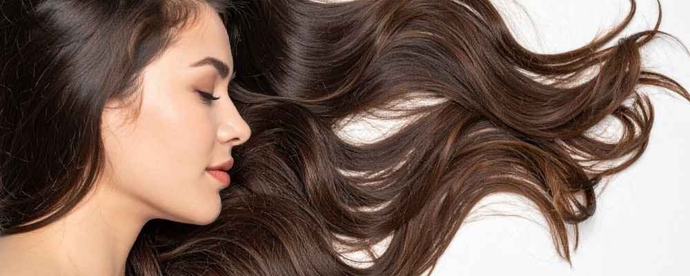 Long, smooth and shiny brown hair after a FABRIQ Reset treatment at re:new Hair & Beauty in Woodhall Spa