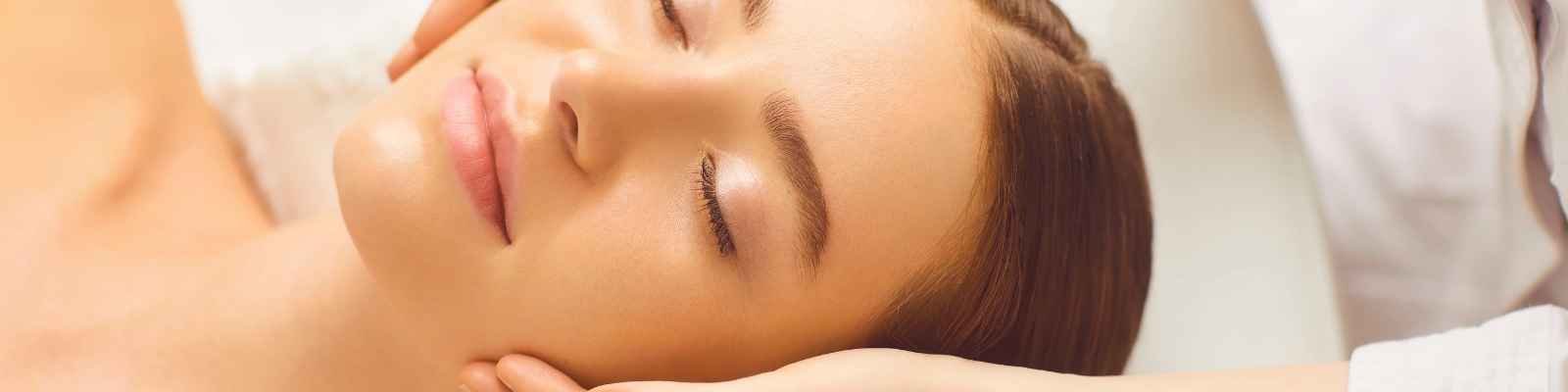 Client relaxing during a PDT light therapy facial treatment at re:new Hair & Beauty in Woodhall Spa